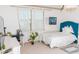 Well-lit bedroom featuring a cozy bed, study desk, and a charming decor that enhances its cozy ambiance at 3100 Stonewyck St, Orlando, FL 32824