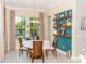 Bright dining area with large windows and decorative shelves at 3100 Stonewyck St, Orlando, FL 32824