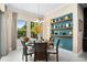 Bright dining area with view to backyard, features contemporary decor and furnishings at 3100 Stonewyck St, Orlando, FL 32824