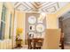 Bright dining room featuring a decorative ceiling, modern lighting, and a collection of decorative wall mirrors at 3100 Stonewyck St, Orlando, FL 32824