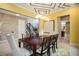 Spacious dining room featuring stylish decor, including modern lighting and a large, formal dining table at 3100 Stonewyck St, Orlando, FL 32824