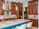 Gourmet kitchen with granite countertops, custom cabinets, and stainless steel appliances at 3100 Stonewyck St, Orlando, FL 32824