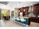 Open kitchen with granite countertops, stainless steel appliances and adjoining dining area at 3100 Stonewyck St, Orlando, FL 32824