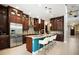 Spacious kitchen with granite countertops, stainless steel appliances, and island seating at 3100 Stonewyck St, Orlando, FL 32824