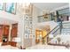 Spacious living area featuring an open floor plan with a staircase, kitchen, and dining room at 3100 Stonewyck St, Orlando, FL 32824