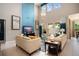 Bright living room with high ceilings, large windows, stylish decor, and a comfortable seating area at 3100 Stonewyck St, Orlando, FL 32824