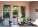 Cozy covered patio with comfortable seating, perfect for outdoor relaxation at 3100 Stonewyck St, Orlando, FL 32824