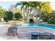 Gorgeous swimming pool with rock features, spa, and lush landscaping at 3100 Stonewyck St, Orlando, FL 32824