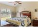Cozy bedroom with vaulted ceiling, neutral walls and natural light from the window at 3112 Enclave Ct, Kissimmee, FL 34746