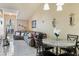 Inviting living room with a large sectional sofa, neutral tones, and ample natural light from the arched window at 3112 Enclave Ct, Kissimmee, FL 34746
