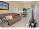 Comfortable living room with plush sectional sofa and open layout to the kitchen at 3112 Enclave Ct, Kissimmee, FL 34746