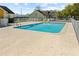A community pool surrounded by a fence and a concrete deck at 3112 Enclave Ct, Kissimmee, FL 34746