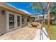 Outdoor patio perfect for entertaining, featuring an outdoor dining set and lounge furniture at 3189 Saint James Ave, Deltona, FL 32738