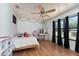 Bright bedroom with wood floors, large windows, and an inviting vanity at 3189 Saint James Ave, Deltona, FL 32738