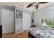 Bedroom with wood floors, a double closet, and natural light at 3189 Saint James Ave, Deltona, FL 32738