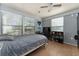 Bedroom featuring a bed, gaming setup, and tiled floors at 3189 Saint James Ave, Deltona, FL 32738