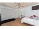 Bedroom with wood floors, a ceiling fan, and a double closet at 3189 Saint James Ave, Deltona, FL 32738