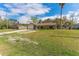 Inviting single-story home with a classic brick facade, lush lawn, and a convenient two-car garage at 3189 Saint James Ave, Deltona, FL 32738