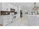 Contemporary kitchen featuring stainless steel appliances, marble tile floors, and a modern design aesthetic at 3189 Saint James Ave, Deltona, FL 32738