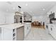 Beautiful kitchen with a central island, marble tile floors, modern stainless steel appliances, and an open layout at 3189 Saint James Ave, Deltona, FL 32738