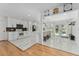 Modern, updated kitchen boasting white cabinets, stainless steel appliances, and an eat-in island at 3189 Saint James Ave, Deltona, FL 32738