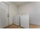Practical laundry room features a washer and dryer, plus a door leading outside at 3189 Saint James Ave, Deltona, FL 32738