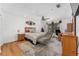 Spacious main bedroom with a sitting area, wood floors, and a ceiling fan at 3189 Saint James Ave, Deltona, FL 32738