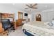 Bedroom featuring a ceiling fan, carpet floors, and a wooden dresser at 3189 Saint James Ave, Deltona, FL 32738
