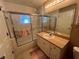 Bathroom showing a shower/tub combination and vanity with a sink at 3449 Village Green Ct, St Cloud, FL 34772