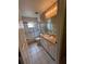 This bathroom features tile flooring, shower and tub combo, and a vanity at 3449 Village Green Ct, St Cloud, FL 34772