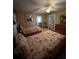 Cozy bedroom featuring two beds, ceiling fan, and neutral decor at 3449 Village Green Ct, St Cloud, FL 34772