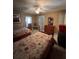 Bedroom features two twin beds, tile floors, ceiling fan, and natural light at 3449 Village Green Ct, St Cloud, FL 34772