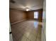 Neutral-colored bedroom with tile floors, a ceiling fan, and natural light at 3449 Village Green Ct, St Cloud, FL 34772