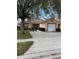 Charming single-story home featuring a one-car garage and a well-maintained front yard at 3449 Village Green Ct, St Cloud, FL 34772