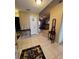 Inviting foyer with tile flooring that flows into the living area, showcasing an open floor plan at 3449 Village Green Ct, St Cloud, FL 34772