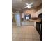 Well-equipped kitchen with white cabinetry, stainless steel appliances, and tile flooring at 3449 Village Green Ct, St Cloud, FL 34772