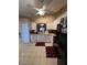 Bright kitchen with white cabinets, tile flooring, and modern appliances at 3449 Village Green Ct, St Cloud, FL 34772