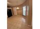 Eat-in kitchen features a pendant light, tile floors and ample natural light from the adjacent window at 3449 Village Green Ct, St Cloud, FL 34772