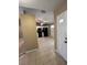 Bright kitchen featuring tile flooring, white cabinets, and black appliances with ample storage space at 3449 Village Green Ct, St Cloud, FL 34772