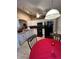 Bright kitchen with white cabinetry, black appliances, and adjacent dining area at 3449 Village Green Ct, St Cloud, FL 34772