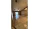 Spacious living room featuring tile flooring, vaulted ceilings, and access to a screened-in patio at 3449 Village Green Ct, St Cloud, FL 34772