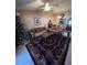 Comfortable living room featuring a ceiling fan, tile flooring, and access to other areas of the home at 3449 Village Green Ct, St Cloud, FL 34772