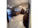 Comfortable living room featuring tile floors and tasteful décor, perfect for relaxation and entertaining at 3449 Village Green Ct, St Cloud, FL 34772