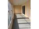 Enclosed back patio providing a versatile space for relaxation, entertainment, or enjoying the outdoors at 3449 Village Green Ct, St Cloud, FL 34772