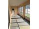 This sunroom features several windows for plenty of natural light at 3449 Village Green Ct, St Cloud, FL 34772