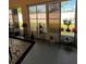 Enclosed sunroom with large windows, neutral paint, and sleek decor offers a cozy and bright space at 3449 Village Green Ct, St Cloud, FL 34772