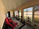 Sunroom features multiple windows, decor, neutral wall, and a view of the backyard at 3449 Village Green Ct, St Cloud, FL 34772