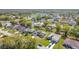 A sprawling neighborhood with mature trees and diverse housing styles at 410 Lark Ct, Kissimmee, FL 34759