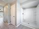 Bathroom with tiled floors and a shower unit at 410 Lark Ct, Kissimmee, FL 34759