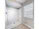 Bathroom with a window and a shower unit at 410 Lark Ct, Kissimmee, FL 34759
